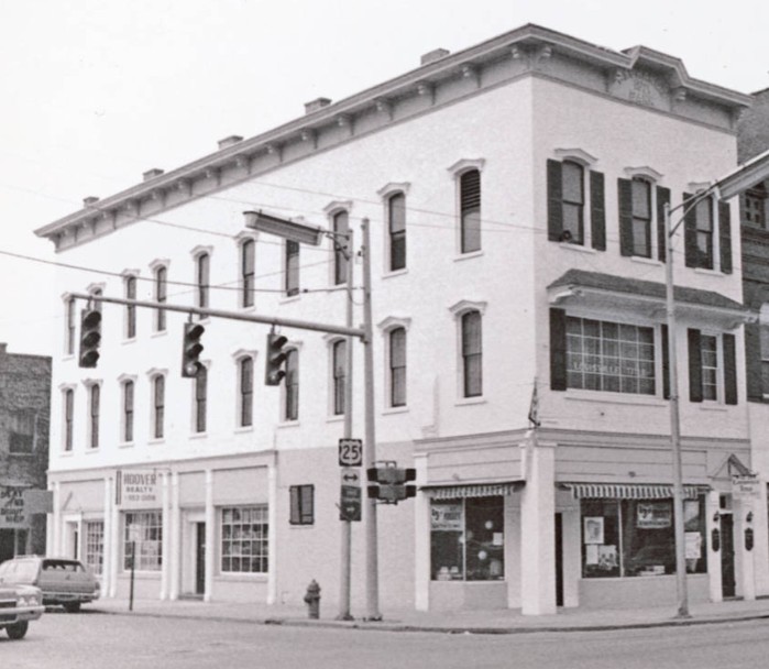 Exchange Bank in the early 1900s, a stark building with large windows.